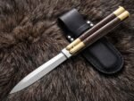 Hare balisong butterfly knife shown with its leather sheath, second view