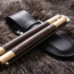 Hare balisong butterfly knife shown with its leather sheath