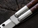 Close up of the Aurochs balisong butterfly knife bolster and pivot