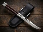 Aurochs balisong butterfly knife shown with its leather sheath