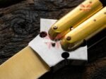 Close up of the Bumblebee balisong butterfly knife bolster and pivot
