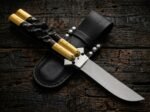 Bumblebee balisong butterfly knife shown with its leather sheath