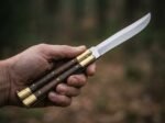 Falcon balisong butterfly knife held in hand