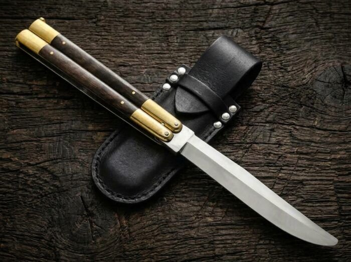 Golden-Crowned balisong butterfly knife shown with its leather sheath