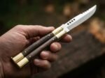 Hamster balisong butterfly knife held in hand
