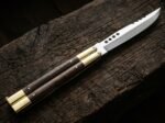Hamster balisong butterfly knife open with the blade showing
