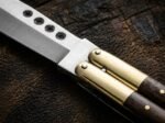 Close up of the Hamster balisong butterfly knife bolster and pivot