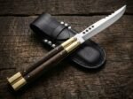 Hamster balisong butterfly knife shown with its leather sheath
