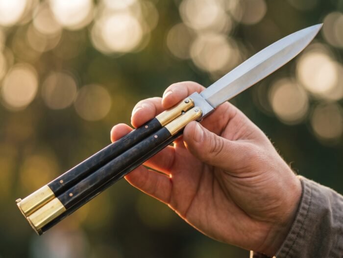 Hornbill balisong butterfly knife held in hand