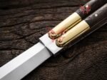 Close up of the Human balisong butterfly knife bolster and pivot, second view
