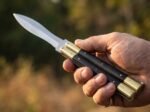Ladybug balisong butterfly knife held in hand