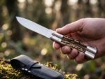 Musang Asian Palm Civet balisong butterfly knife held in hand