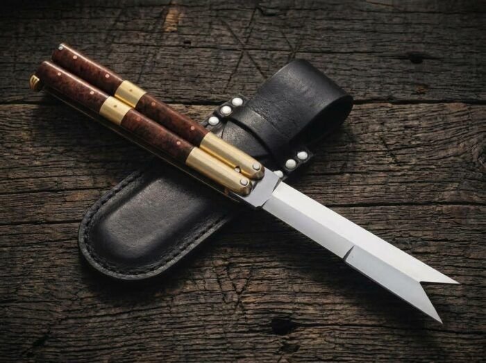 Amihan balisong butterfly knife shown with its leather sheath