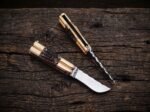 Munting balisong butterfly knife shown next to a second knife