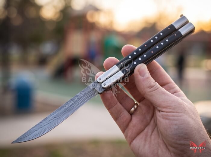 Bukal balisong butterfly knife held in hand