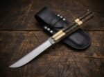 Kalayaan balisong butterfly knife shown with its leather sheath