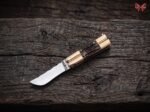 Munting balisong butterfly knife open with the blade showing, second view