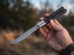 Ilog balisong butterfly knife held in hand
