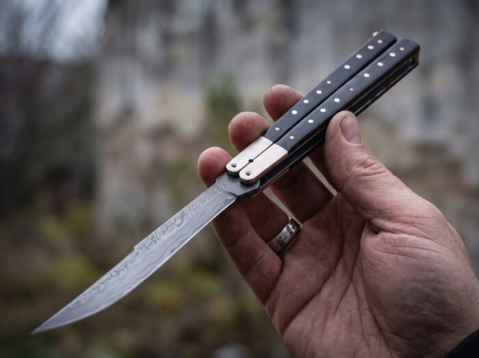Batis balisong butterfly knife held in hand