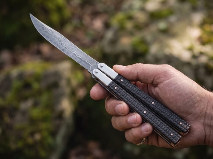 Dilim balisong butterfly knife held in hand