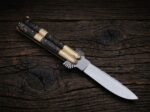 Tanglaw balisong butterfly knife open with the blade showing, second view