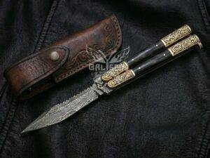 BF-145 Damascus balisong butterfly knife, layered Damascus blade, black horn handle with engraved brass bolsters (view 3)