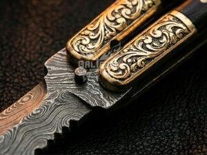 BF-145 Damascus balisong butterfly knife, layered Damascus blade, black horn handle with engraved brass bolsters (view 2)