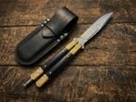 Ginto balisong butterfly knife shown with its leather sheath
