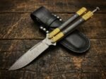 Ginto balisong butterfly knife shown with its leather sheath, second view