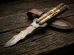 Kalaw balisong butterfly knife shown with its leather sheath, second view