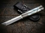 Perlas balisong butterfly knife shown with its leather sheath