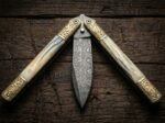 Sinauna balisong butterfly knife caught half open