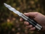 Uling balisong butterfly knife held in hand
