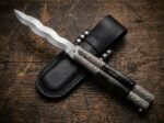 Uling balisong butterfly knife shown with its leather sheath