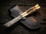 Lakas balisong butterfly knife shown with its leather sheath, second view
