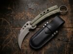Dahon karambit balisong knife shown with its leather sheath