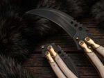 Close up of the Ulan karambit balisong knife blade