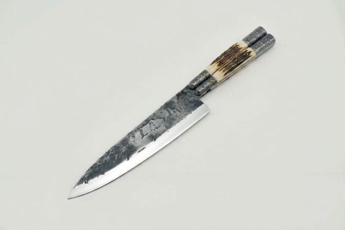 Hand forged balisong chef knife with dark forge finished high carbon blade and stag handle