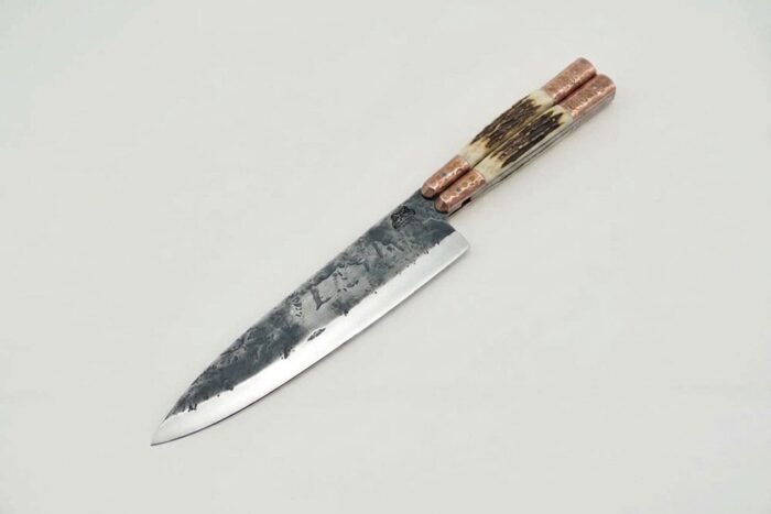 Hand forged balisong chef knife with forge finished high carbon blade, stag handle and copper bolsters
