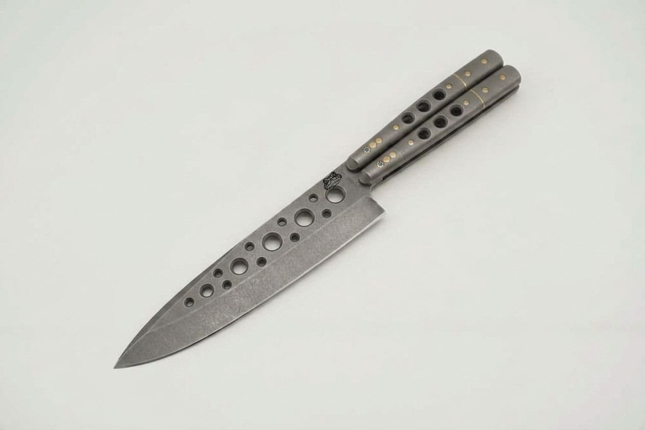 Handmade balisong chef knife with matte stone washed D2 blade, drilled hollows and ram horn handle Handmade balisong chef knife with matte stone washed D2 blade, drilled hollows and ram horn handle