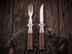 Saluhan balisong steak knife and fork set open with the blade showing