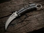 Kidlat karambit balisong knife open with the blade showing