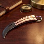 Liyab karambit balisong knife open with the blade showing, second view