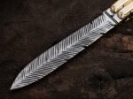 Close up of the Monarch balisong butterfly knife blade and its patterned finish