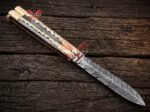 Monarch balisong butterfly knife caught half open showing the handle swing