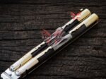Close up of the Mongoose balisong butterfly knife carabao and deer horn handle scales with brass pins