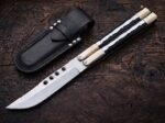 Mule balisong butterfly knife closed beside its black leather belt sheath