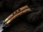 Olive burl wood handle and brass bolsters of the karambit balisong butterfly knife BF-185